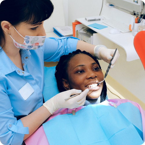 A dentist providing cosmetic care to a patient