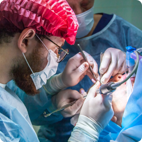 A dentist and assistant providing restorative care to a patient.