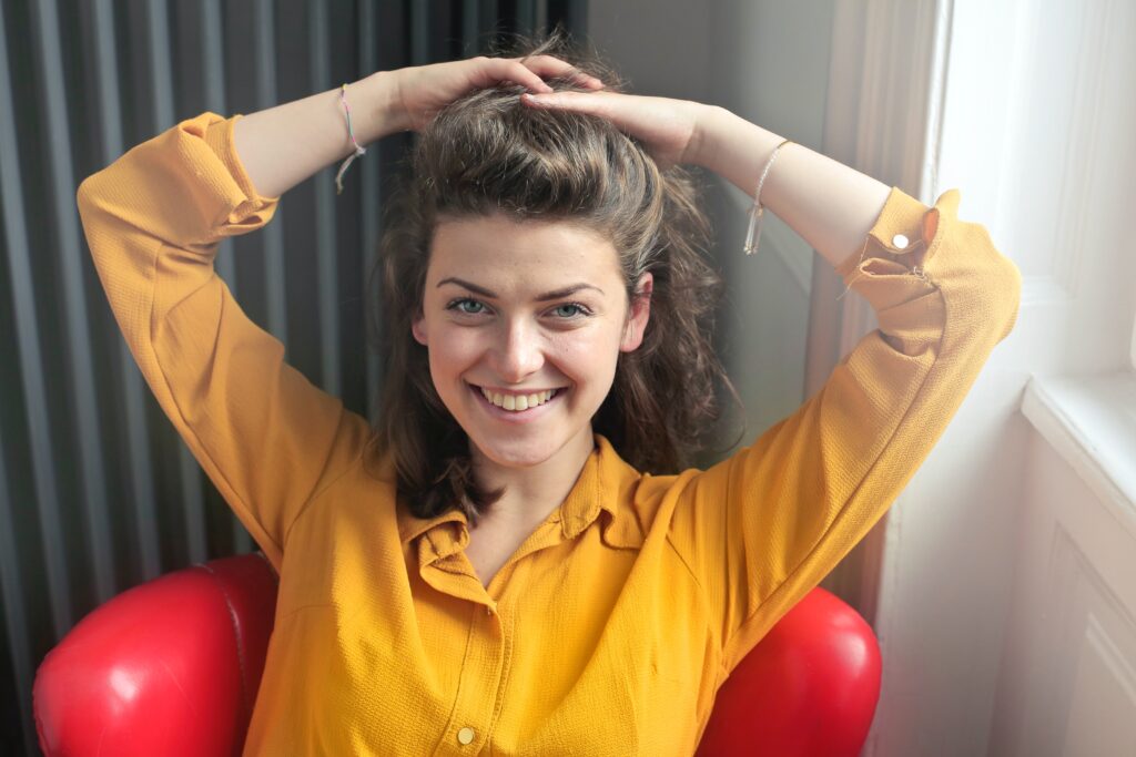 A smiling woman after receiving laser gum therapy